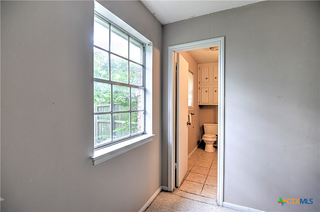 305 Tanglewood Road Temple, TX 76502 - Photo 19 of 46 a view of a hallway with a outdoor space