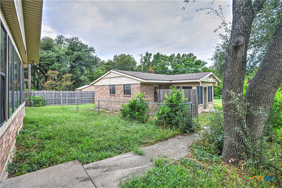 305 Tanglewood Road Temple, TX 76502 - Photo 25 of 46 a house with green field in front of it
