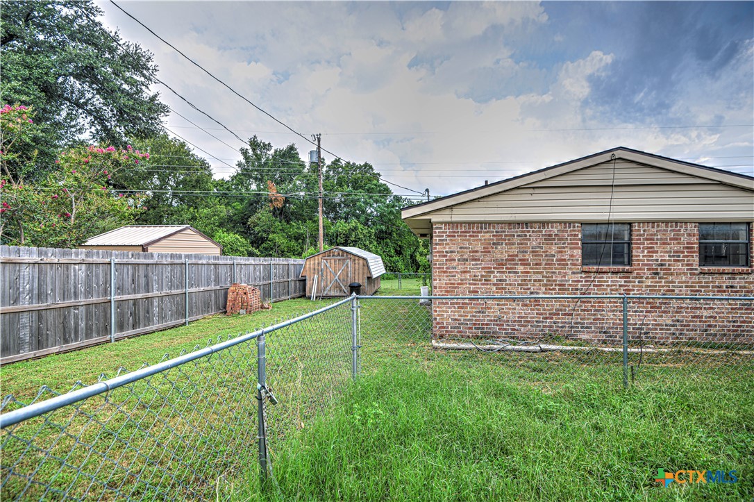305 Tanglewood Road Temple, TX 76502 - Photo 27 of 46 a front view of a house with a yard