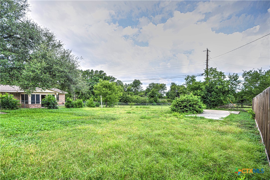 305 Tanglewood Road Temple, TX 76502 - Photo 29 of 46 a view of a backyard with plants and large trees