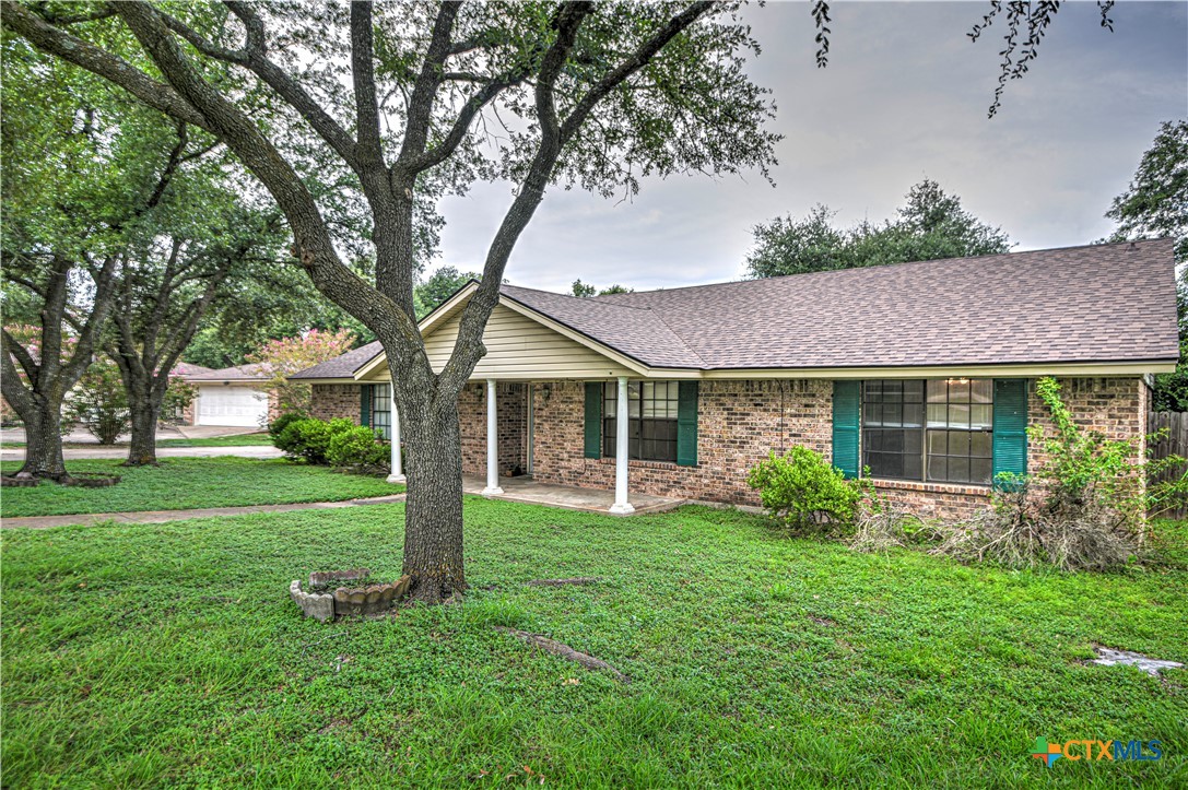 305 Tanglewood Road Temple, TX 76502 - Photo 3 of 46 a front view of a house with garden