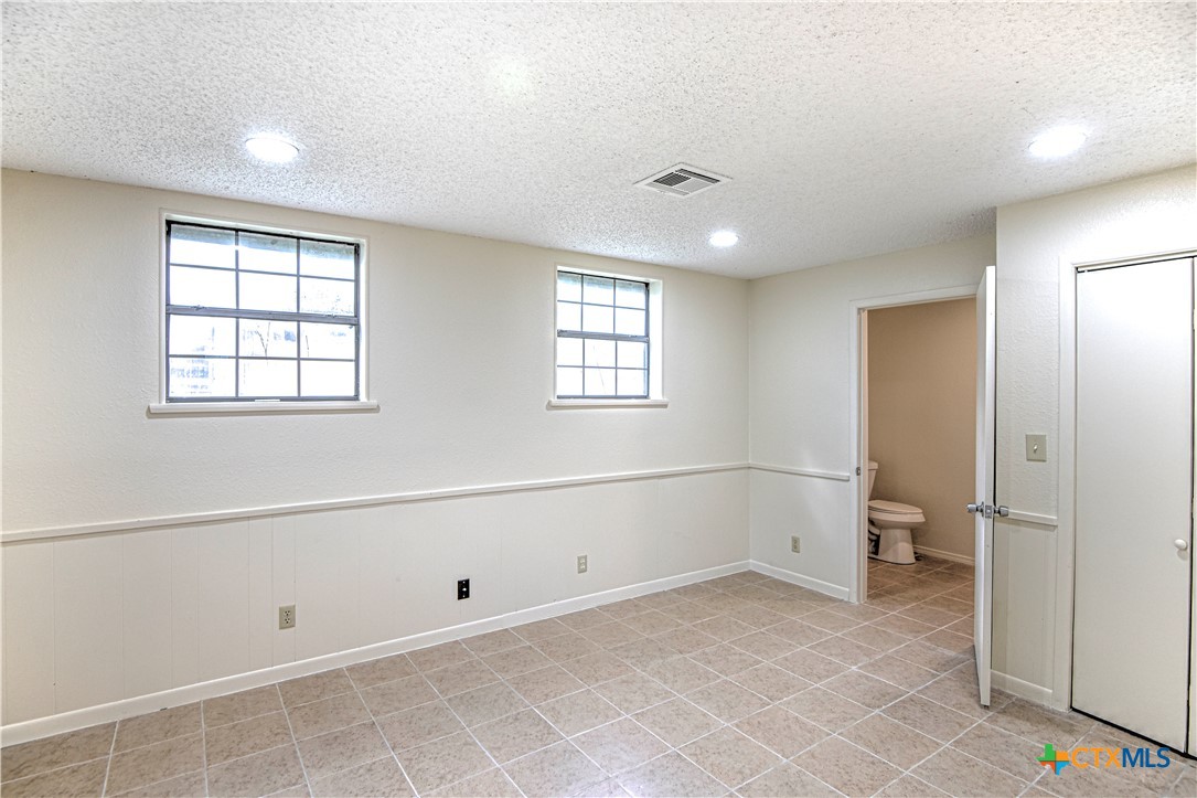 305 Tanglewood Road Temple, TX 76502 - Photo 37 of 46 a view of an empty room with a window