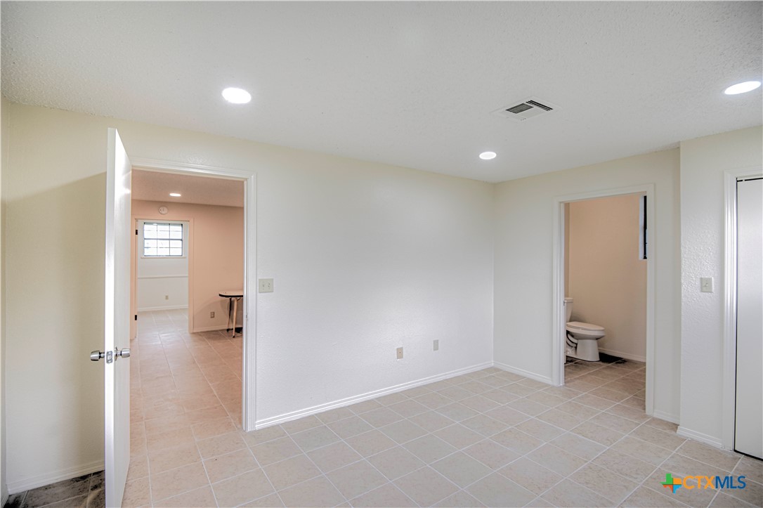 305 Tanglewood Road Temple, TX 76502 - Photo 43 of 46 a view of a hallway with a livingroom and a bathroom