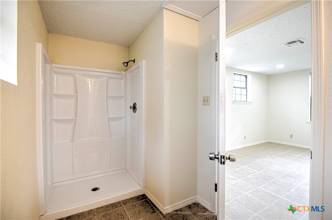 305 Tanglewood Road Temple, TX 76502 - Photo 45 of 46 a bathroom with a shower