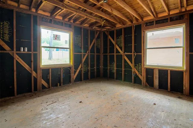 a view of a patio with a table and chairs