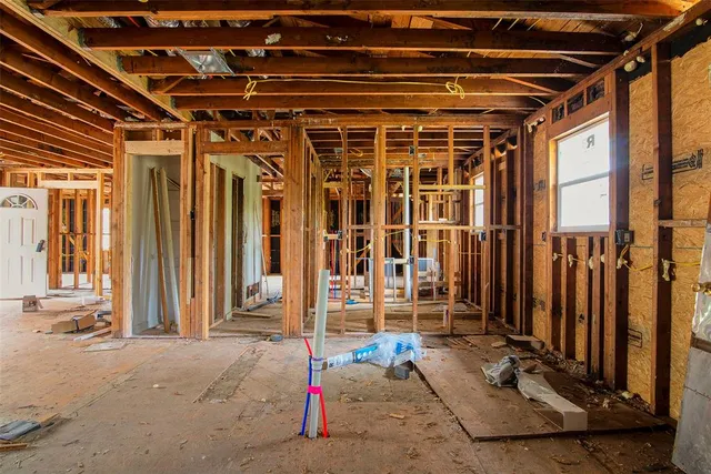 a view of backyard with large trees