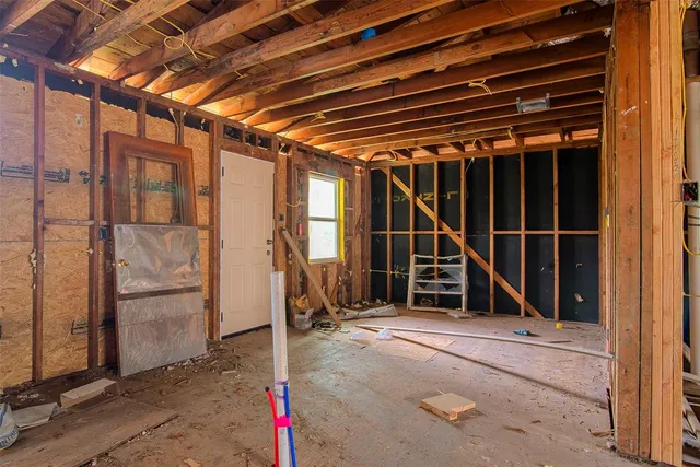 a backyard of a house with outdoor seating