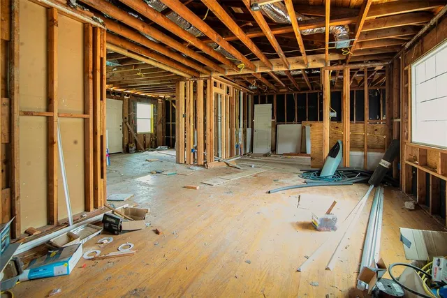 a view of a field with trees in the background