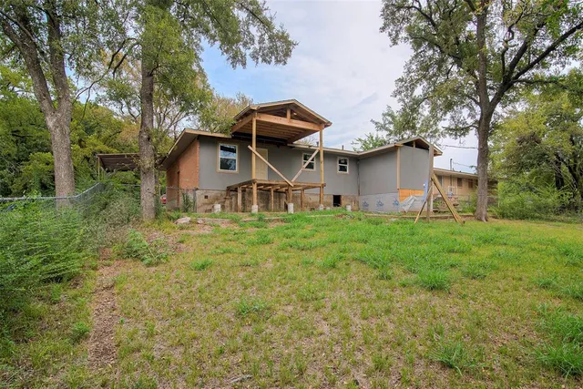 a backyard of a house with lots of green space