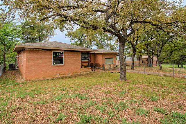 a house with trees in the background
