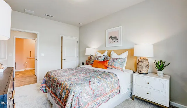 a bedroom with a bed and window