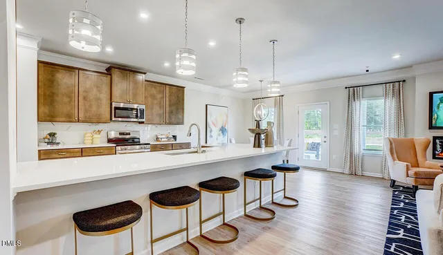 a large kitchen with a table and chairs in it