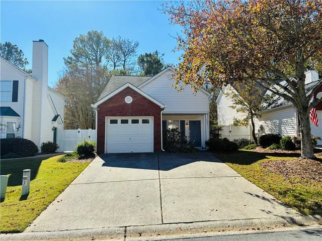 a house with trees in the background