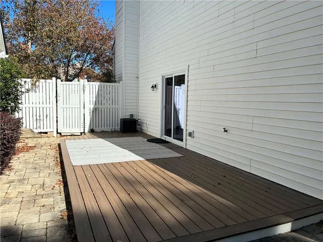 a view of a backyard with wooden floor