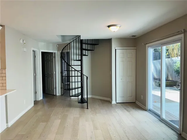 a view of entryway with wooden floor