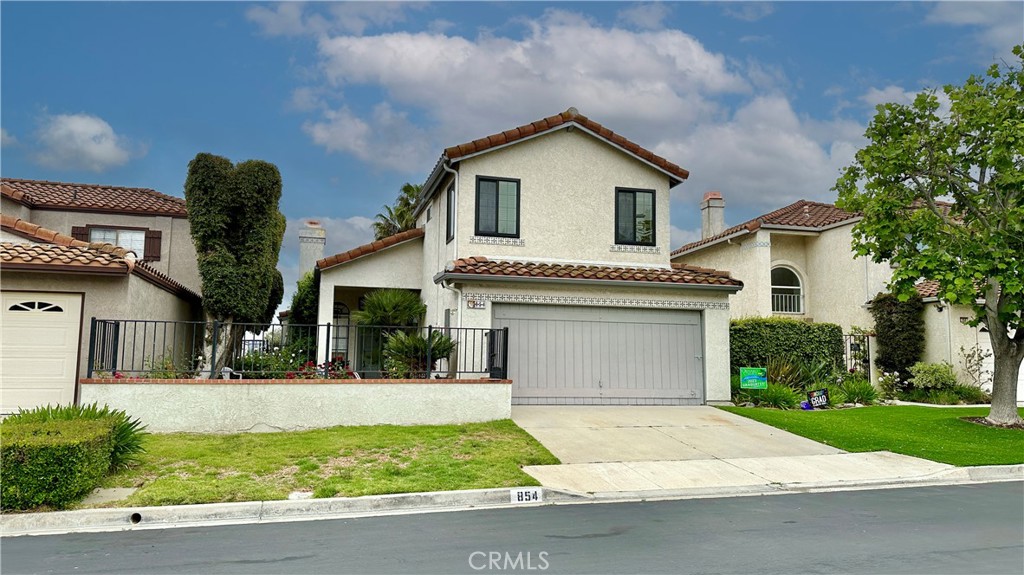 854 Congressional Road Simi Valley, CA 93065 - Photo 1 of 1 a front view of a house with garage