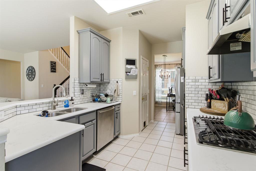 6625 Hayling Way Denton, TX 76210 - Photo 11 of 33 a kitchen with a sink stove and cabinets