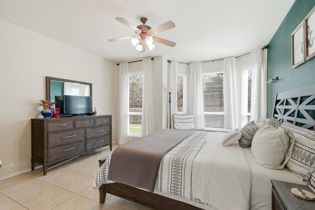 6625 Hayling Way Denton, TX 76210 - Photo 15 of 33 a bedroom with a bed a window and dresser