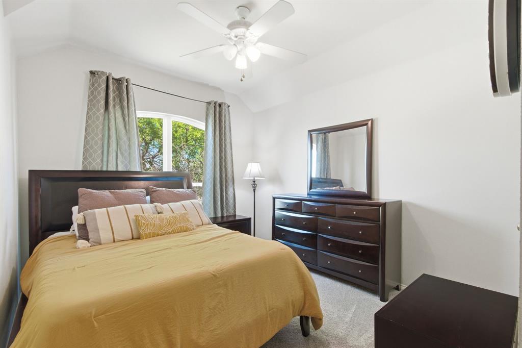 6625 Hayling Way Denton, TX 76210 - Photo 22 of 33 a bedroom with a bed and a dresser