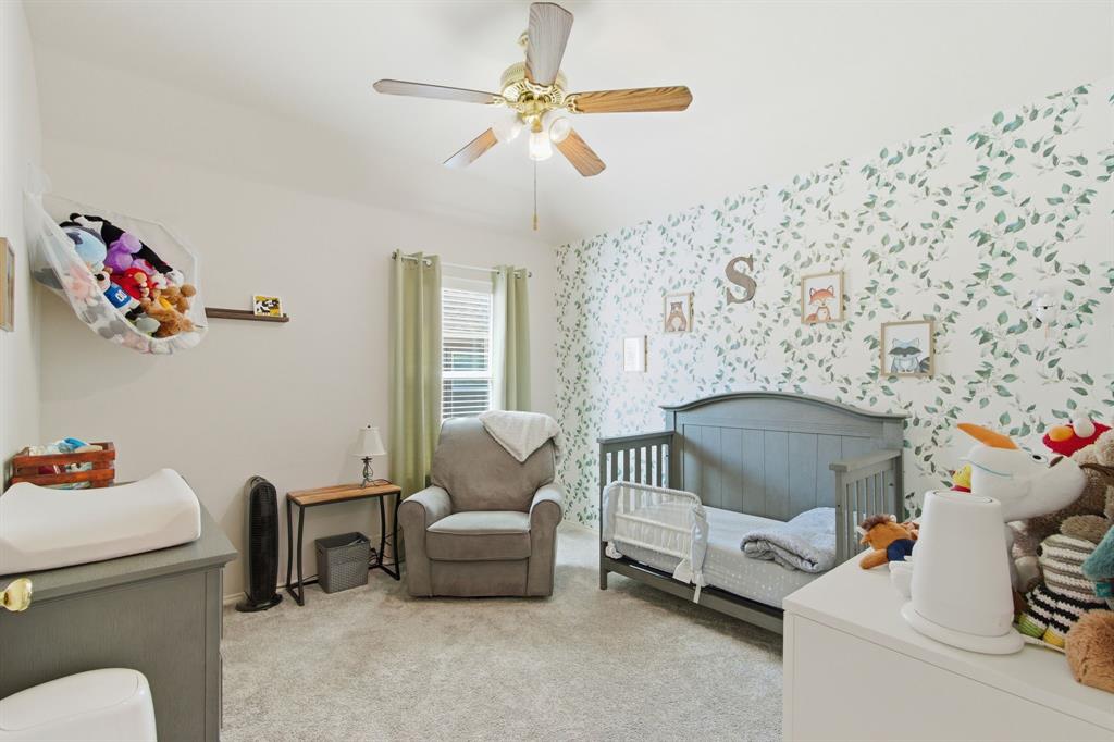 6625 Hayling Way Denton, TX 76210 - Photo 23 of 33 a living room with furniture and a chandelier