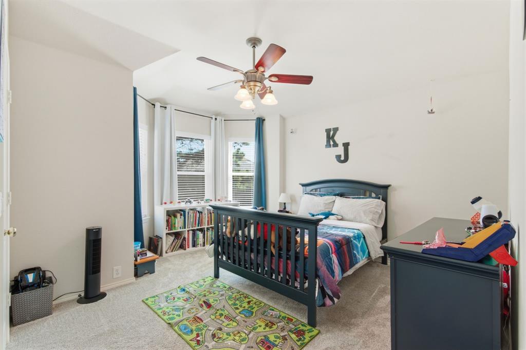 6625 Hayling Way Denton, TX 76210 - Photo 24 of 33 a bed room with furniture and a window