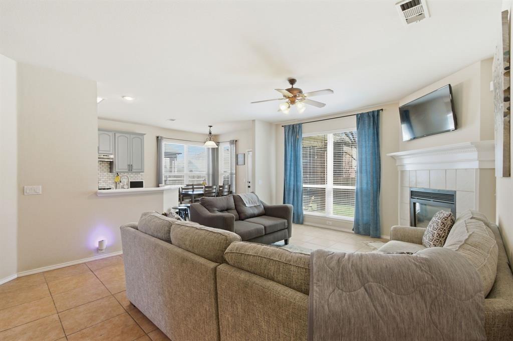 6625 Hayling Way Denton, TX 76210 - Photo 5 of 33 a living room with furniture and a fireplace