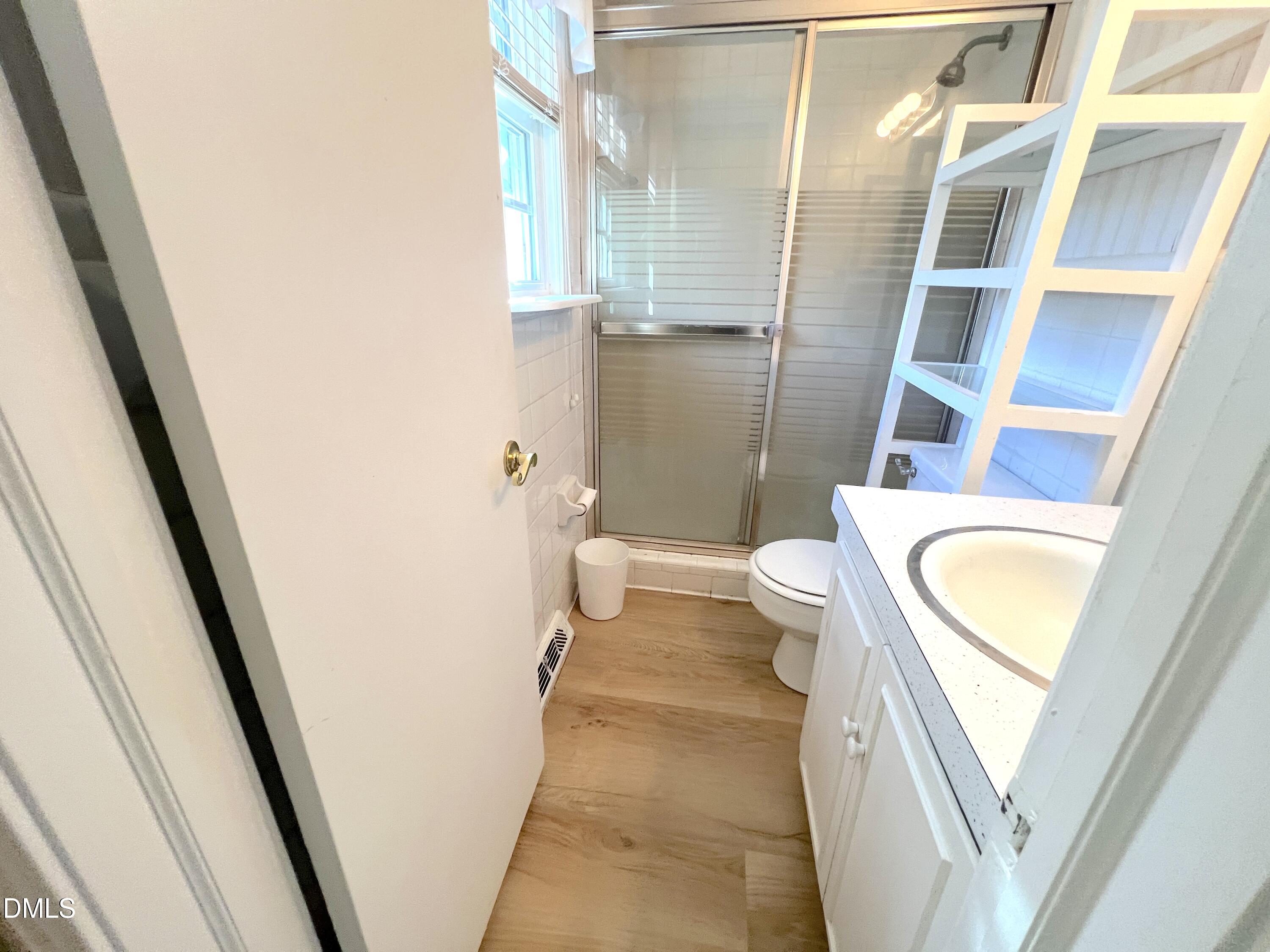 66 Allensville Road Roxboro, NC 27573 - Photo 16 of 52 a bathroom with a toilet and a shower