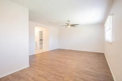 a view of an empty room with a window