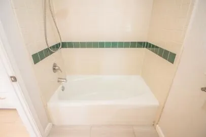 a bathroom with a shower and a shower head