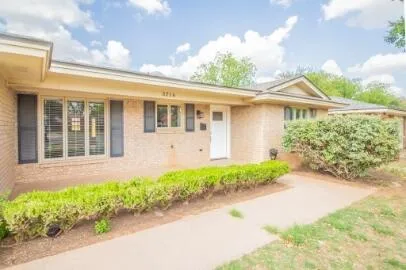 front view of house with a yard