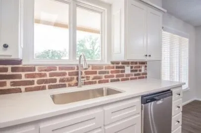 a kitchen with a sink and a window
