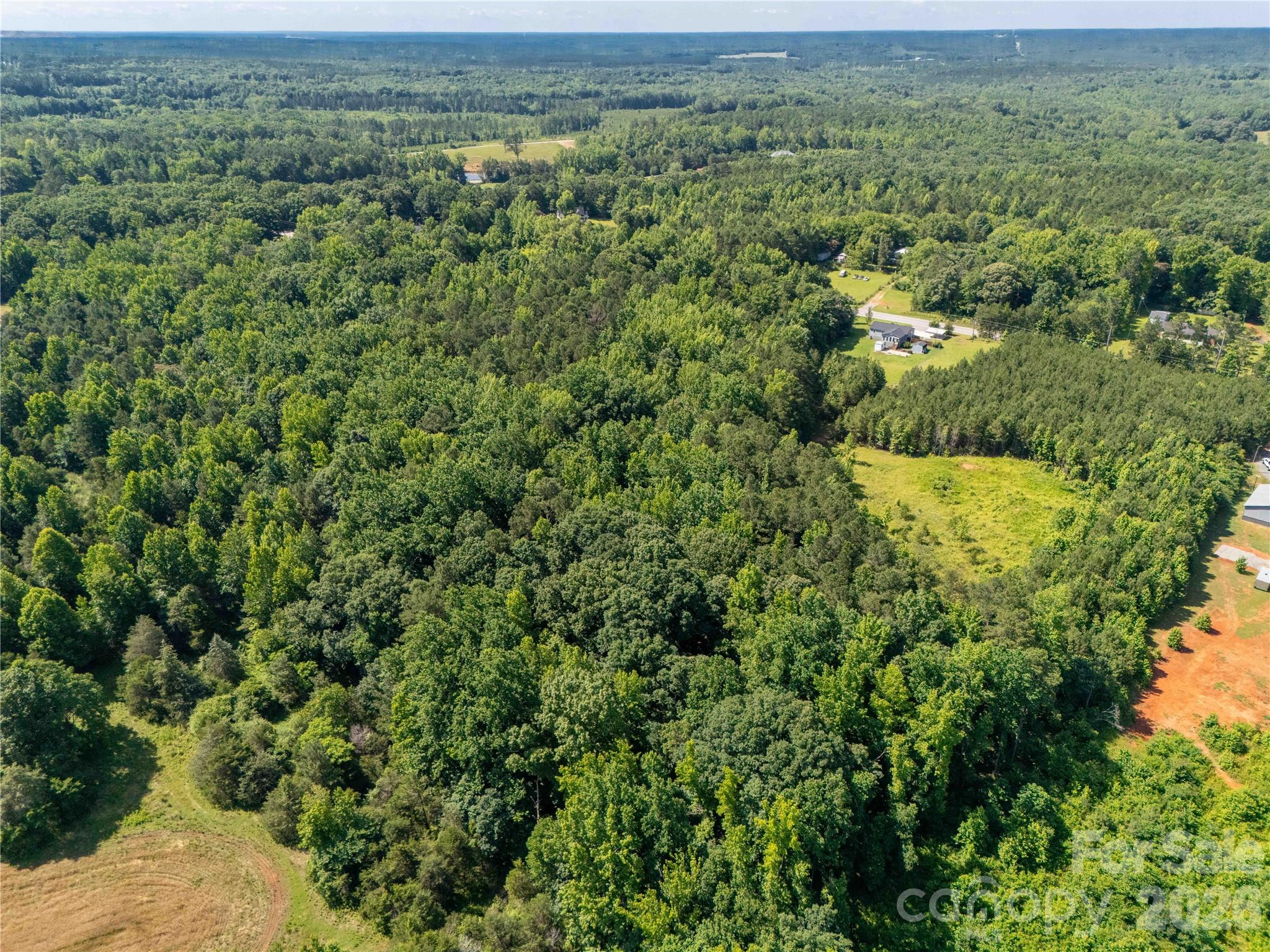 12.85-acres 12.85-acres Flat Creek Road Heath Springs, SC 29058 - Photo 6 of 7 an aerial view of residential houses with outdoor space and trees