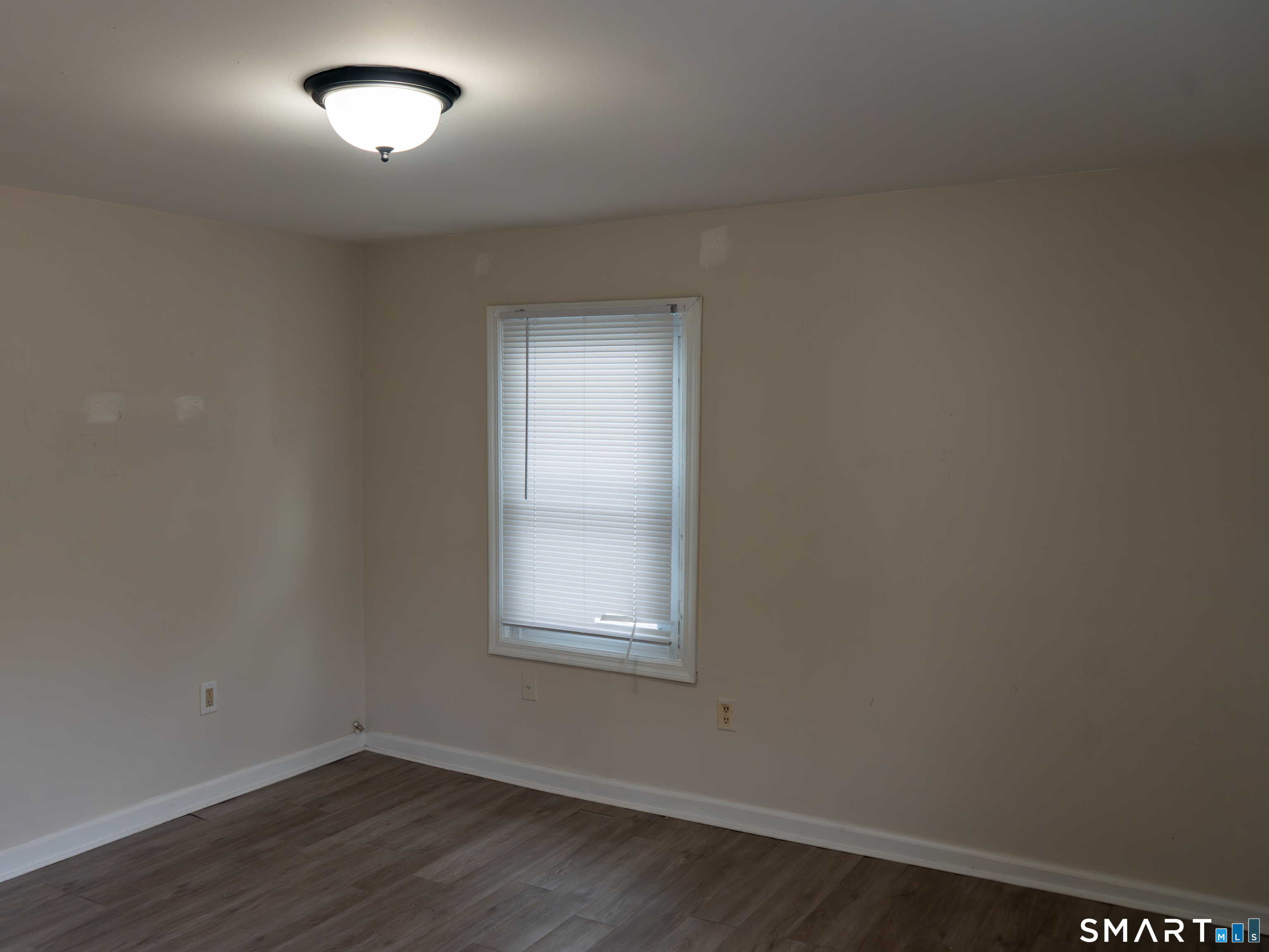 406 Poplar Street New Haven, CT 06513 - Photo 18 of 22 an empty room with wooden floor and windows