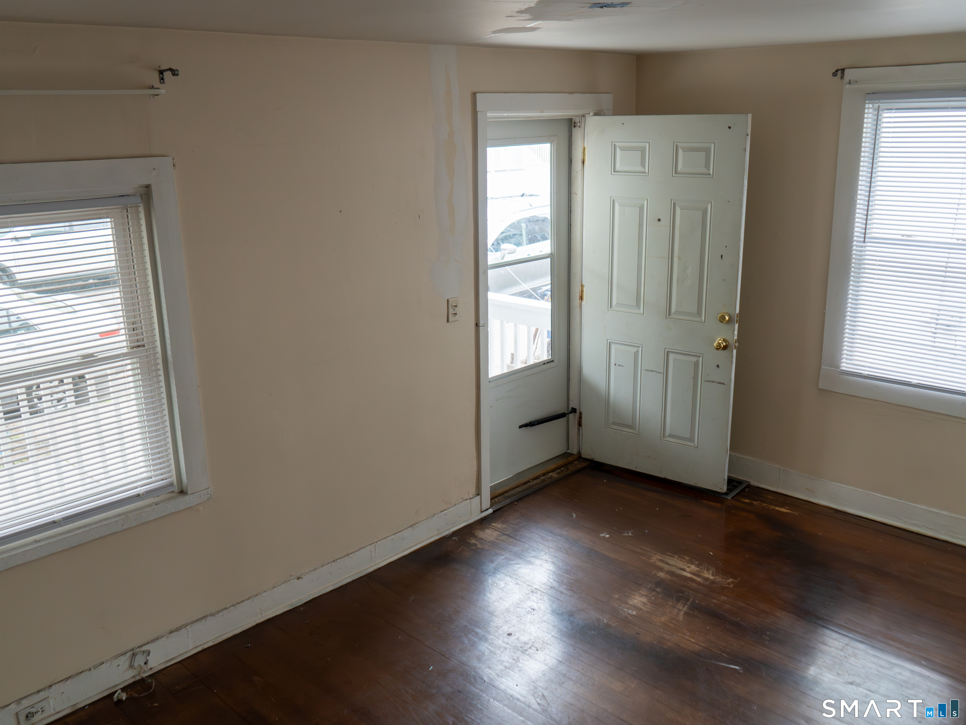 406 Poplar Street New Haven, CT 06513 - Photo 2 of 22 an empty room with wooden floor and windows