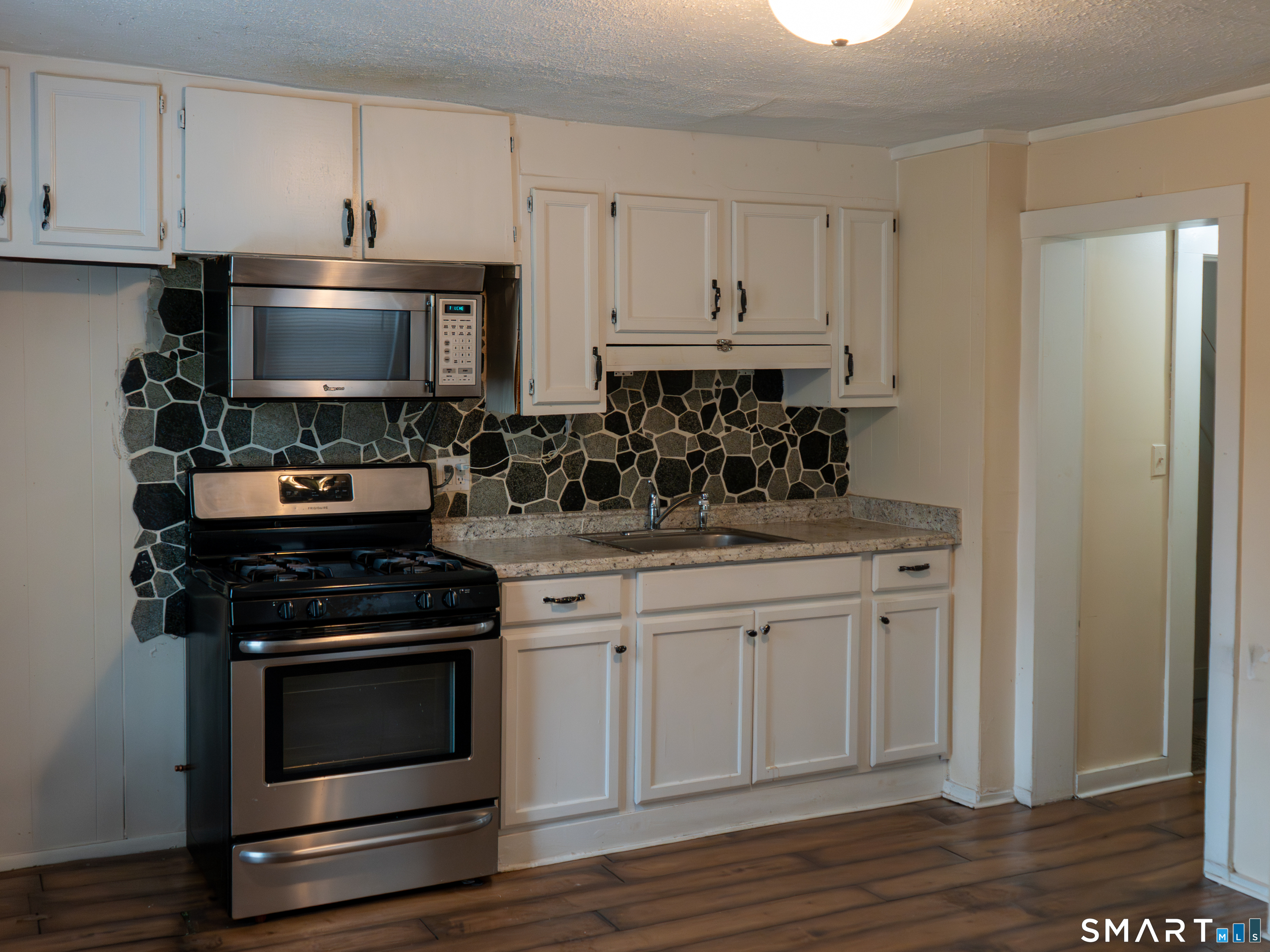 406 Poplar Street New Haven, CT 06513 - Photo 5 of 22 a kitchen with appliances a sink and cabinets