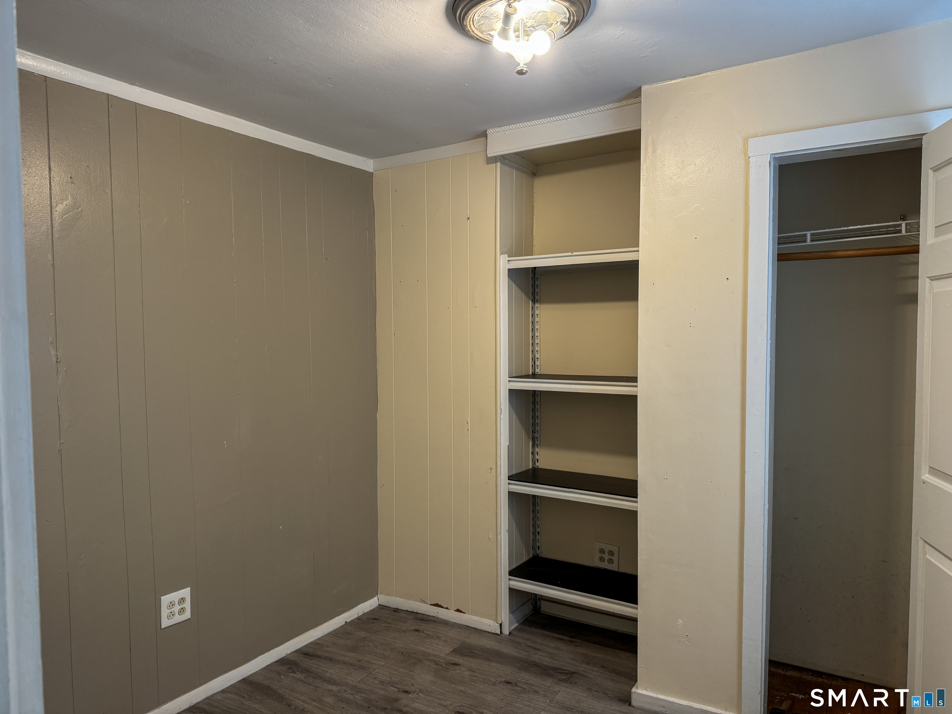 406 Poplar Street New Haven, CT 06513 - Photo 8 of 22 a view of walk in closet with empty racks