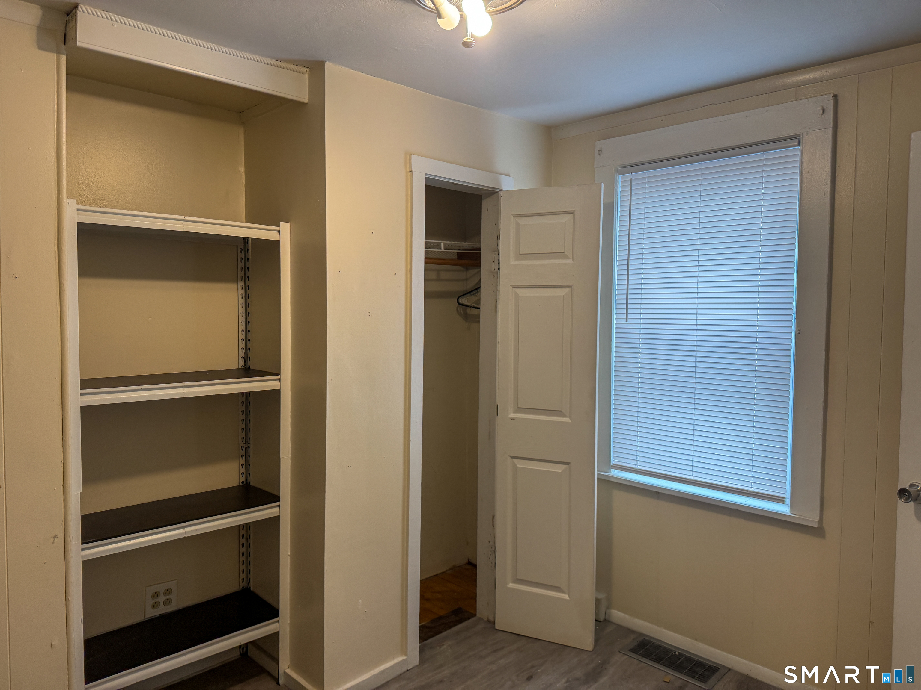 406 Poplar Street New Haven, CT 06513 - Photo 9 of 22 a view of an empty room with closet and a window