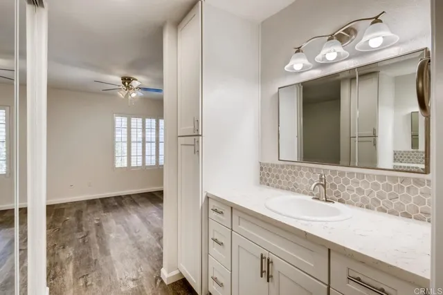 a bathroom with a sink double vanity and a mirror
