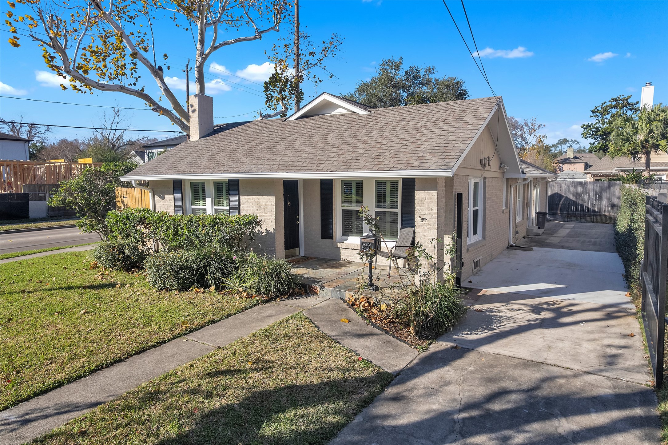3932 Marquette Street Houston, TX 77005 - Photo 1 of 31 a front view of a house with yard and green space
