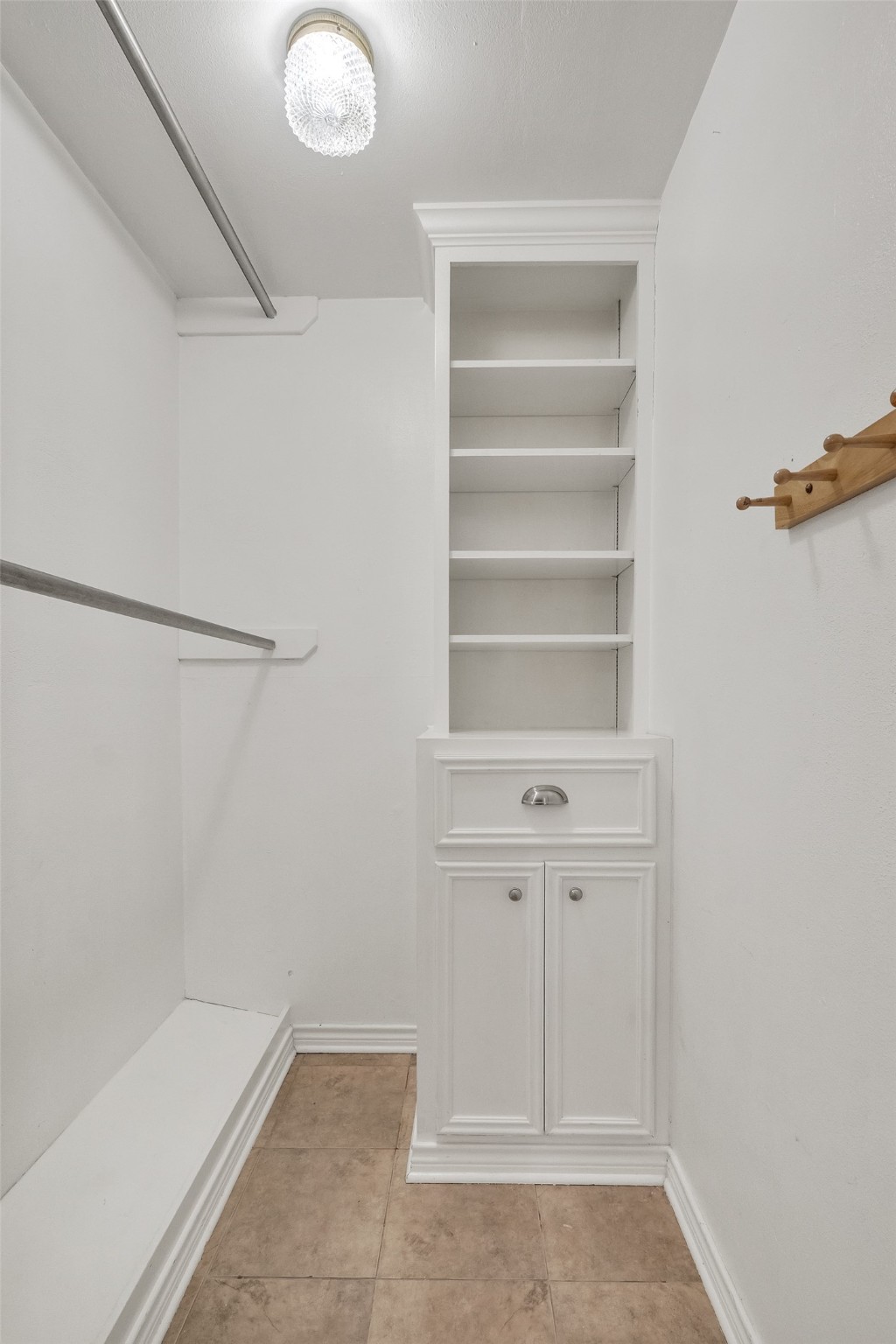 3932 Marquette Street Houston, TX 77005 - Photo 16 of 31 a view of walk in closet with empty racks