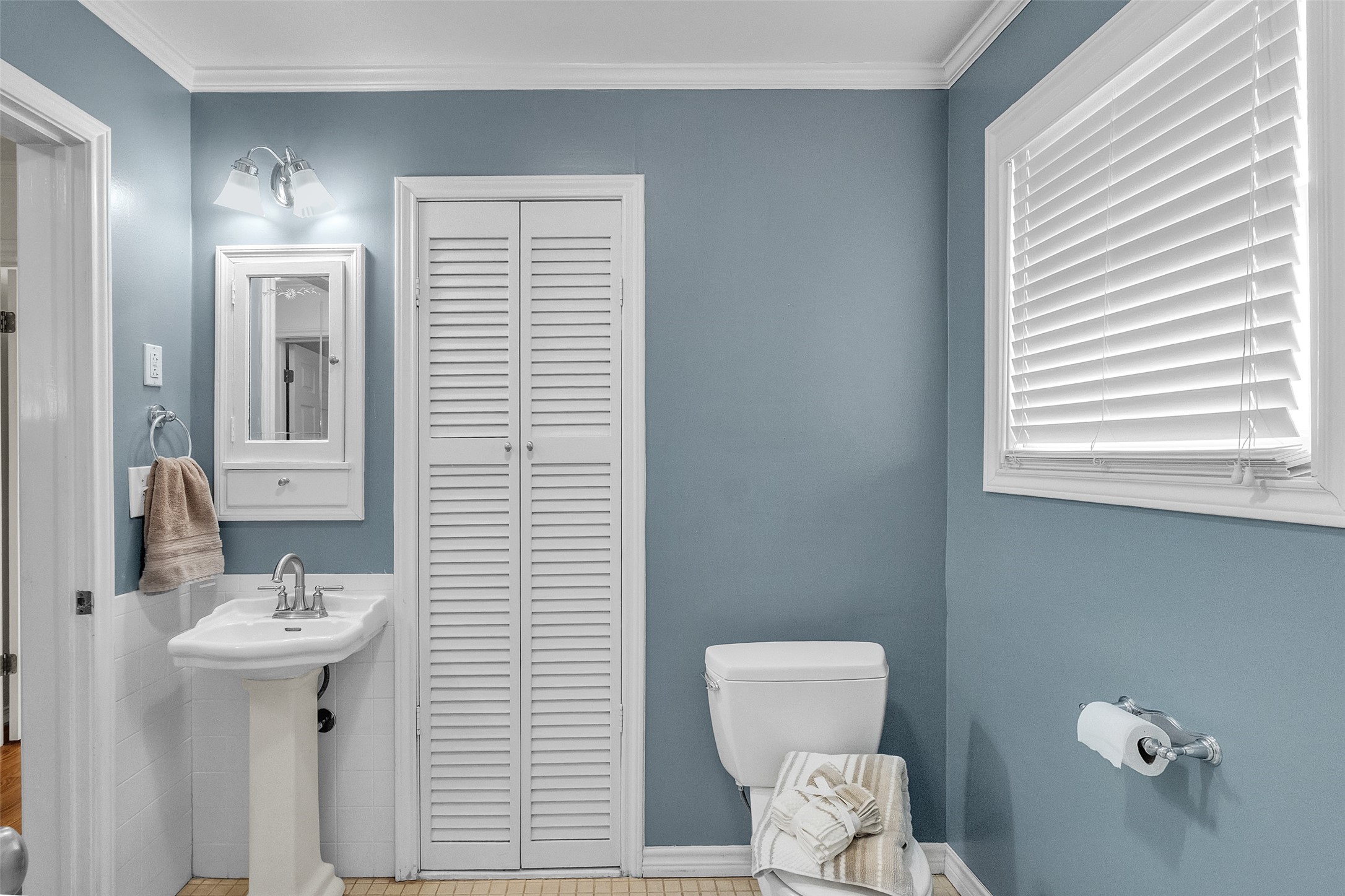 3932 Marquette Street Houston, TX 77005 - Photo 18 of 31 a bathroom with a sink a mirror and a toilet
