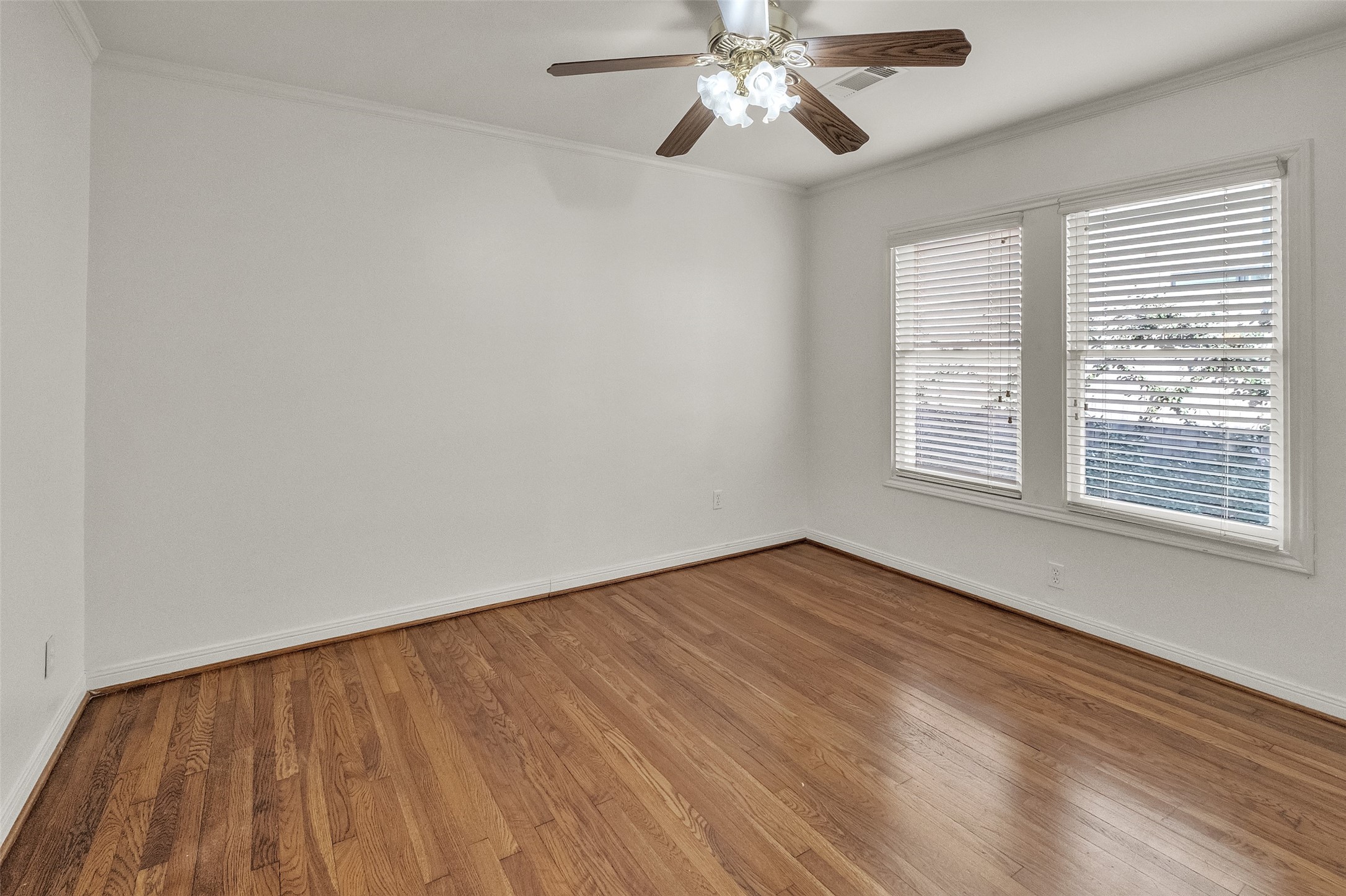 3932 Marquette Street Houston, TX 77005 - Photo 19 of 31 wooden floor in an empty room with a window