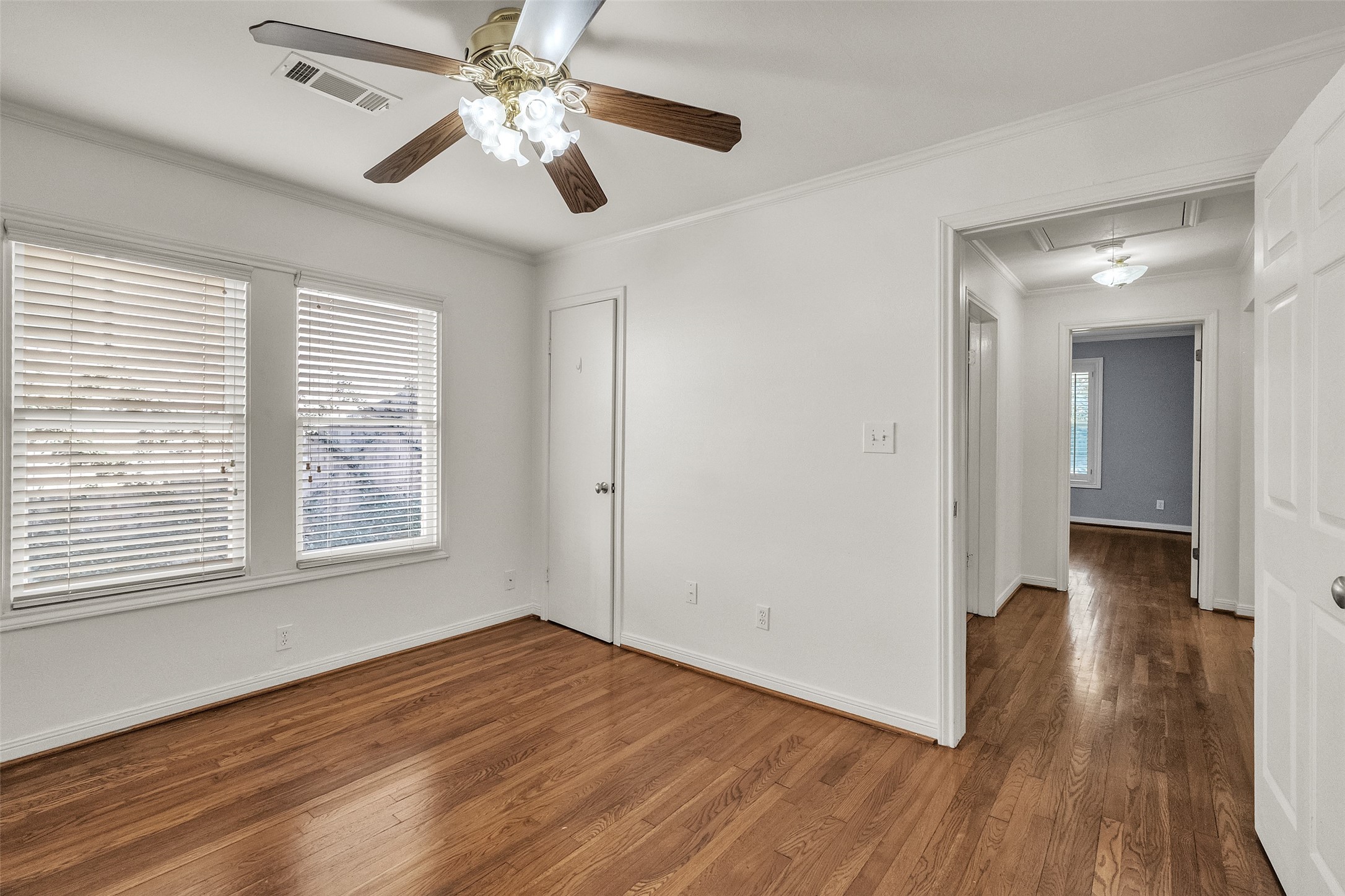 3932 Marquette Street Houston, TX 77005 - Photo 20 of 31 a view of an empty room with wooden floor and a window