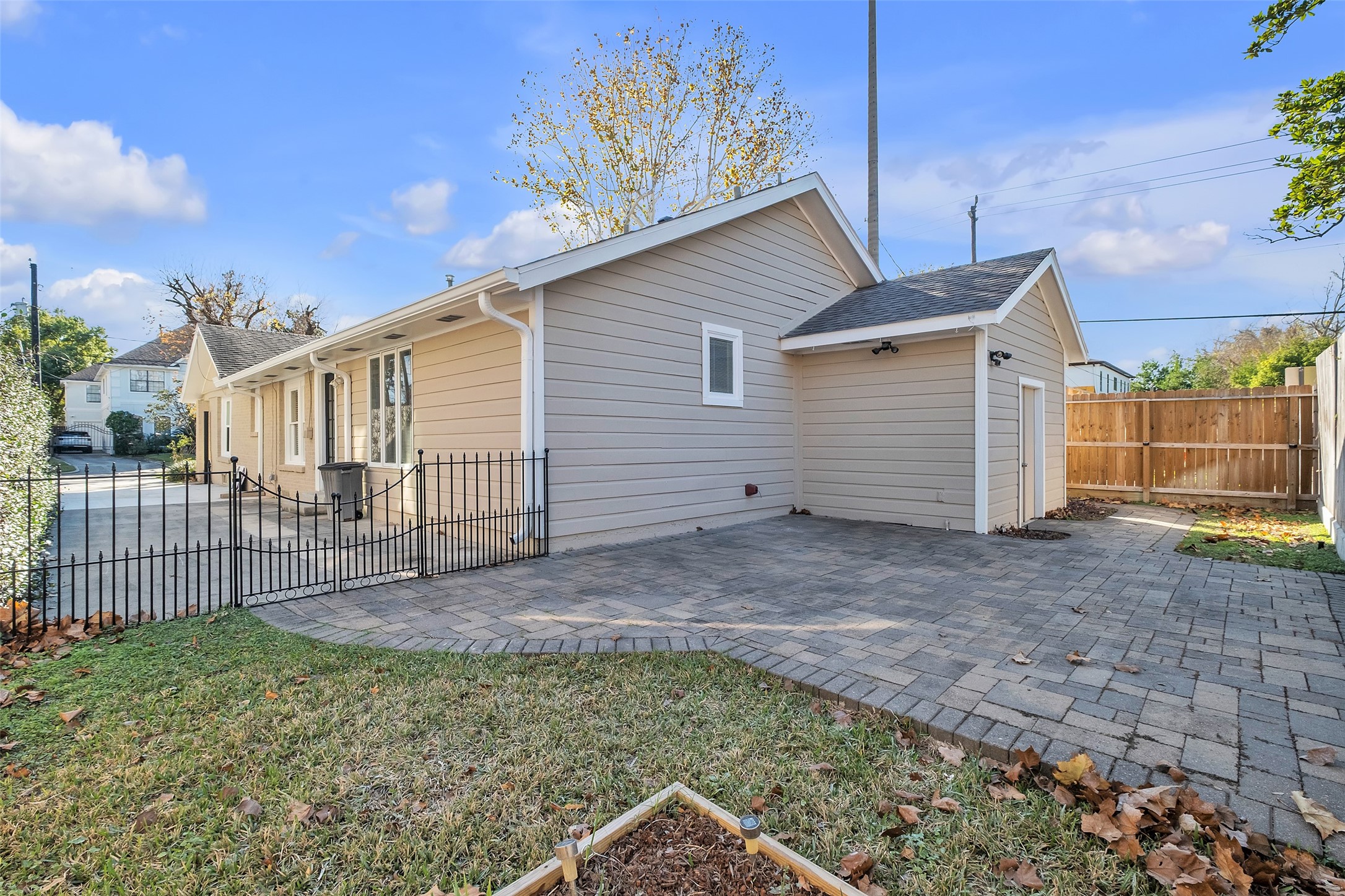 3932 Marquette Street Houston, TX 77005 - Photo 24 of 31 a view of a house with a backyard and stairs