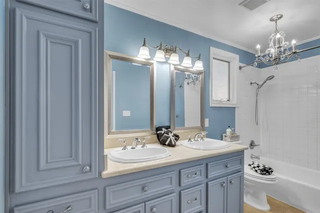 a bathroom with a sink double vanity and a mirror