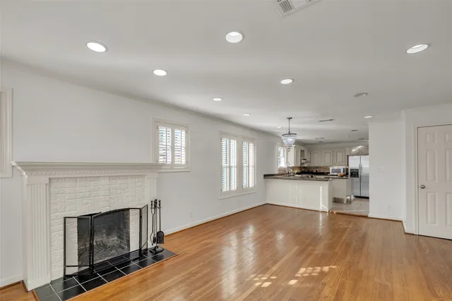 a kitchen with granite countertop a sink stove and cabinets