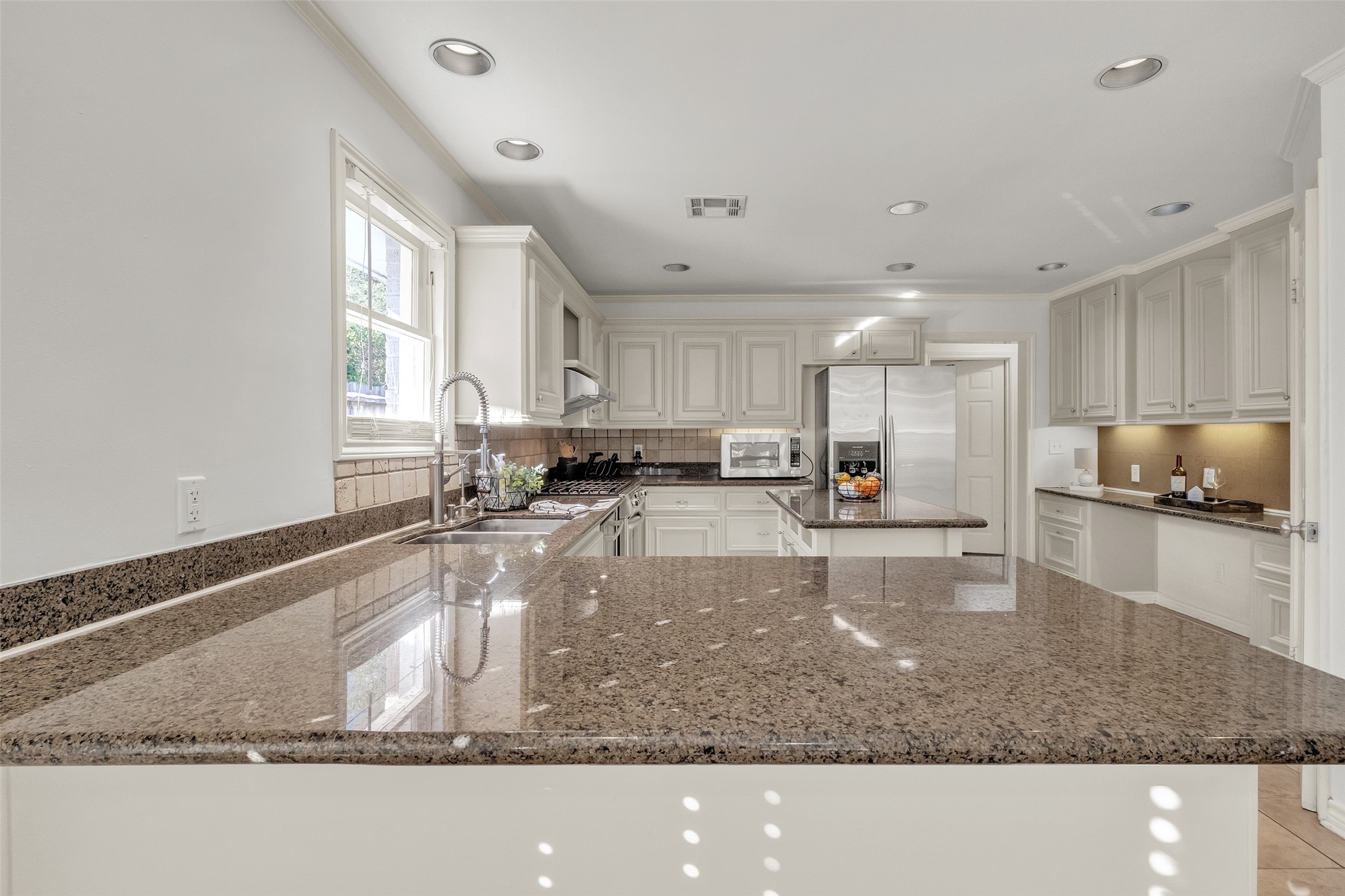 3932 Marquette Street Houston, TX 77005 - Photo 8 of 31 a large kitchen with a large window in it