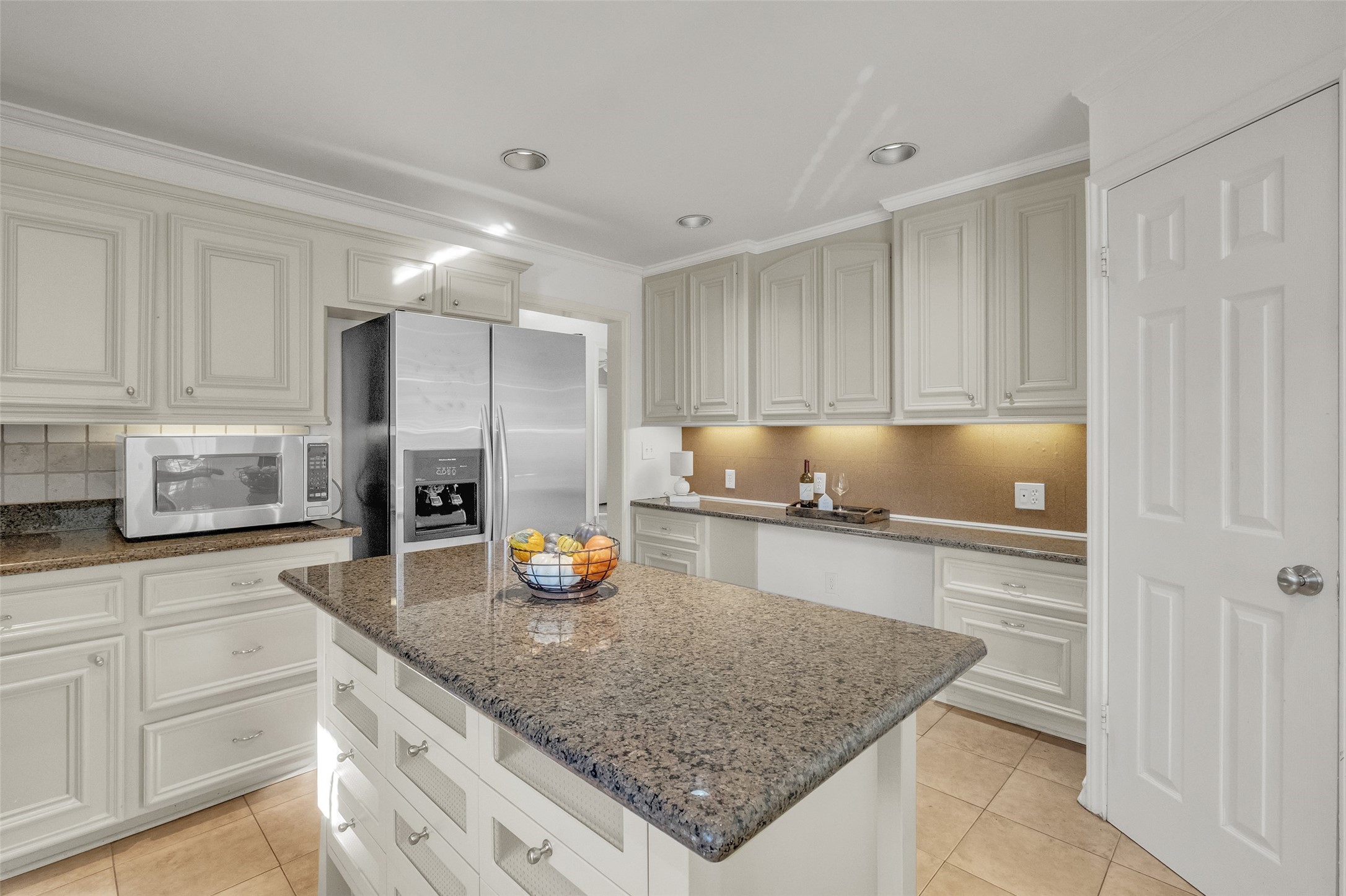 3932 Marquette Street Houston, TX 77005 - Photo 9 of 31 a kitchen with a sink a counter and cabinets