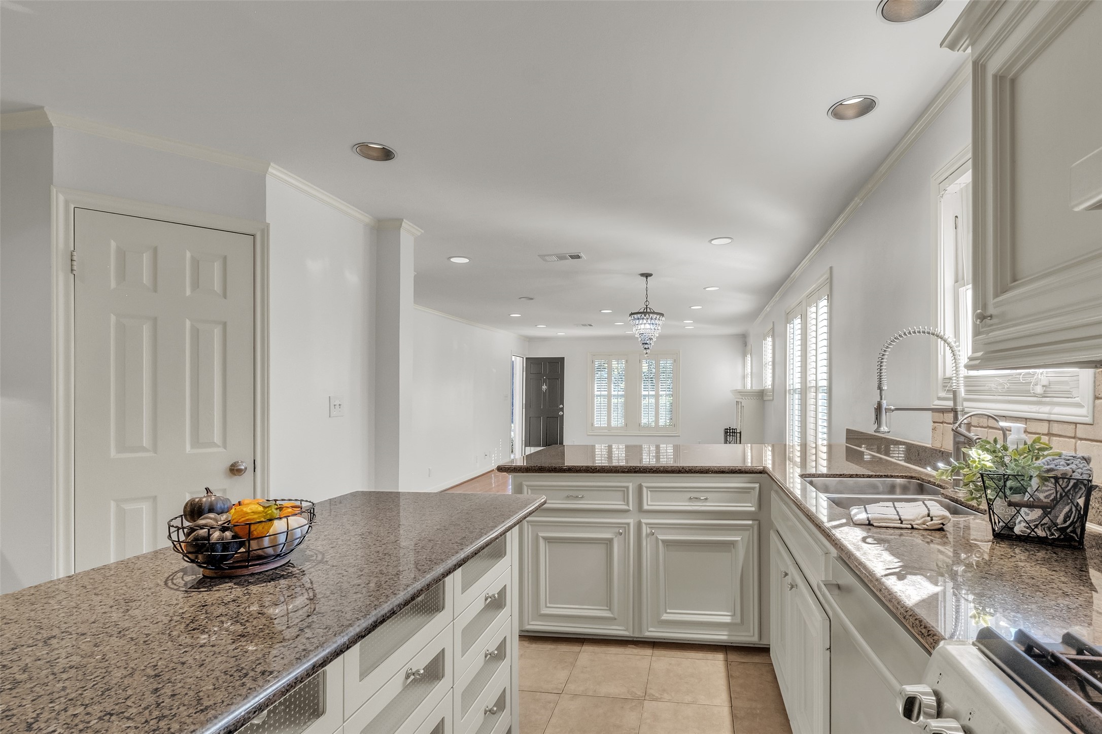 3932 Marquette Street Houston, TX 77005 - Photo 10 of 31 a kitchen with granite countertop a sink stove and cabinets