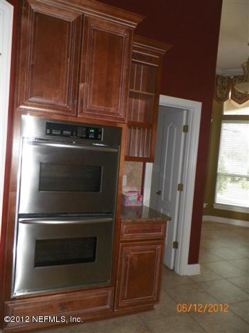 2000 River's Own Road St. Augustine, FL 32092 - Photo 13 of 36 a stove top oven sitting inside of a kitchen